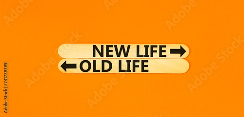 New or old life symbol. Concept word New life Old life on beautiful wooden stick. Beautiful orange table orange background. Business and new or old life concept. Copy space.