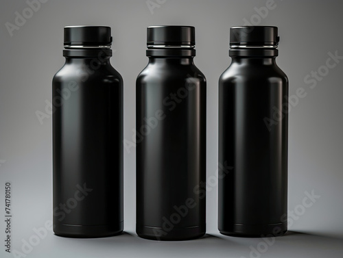 Three Black Water Bottles Aligned Together