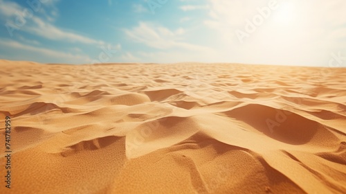 A vast expanse of sand dunes under a clear blue sky
