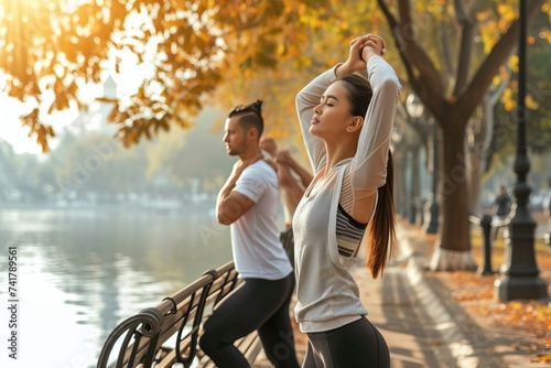 People exercising in the pa...