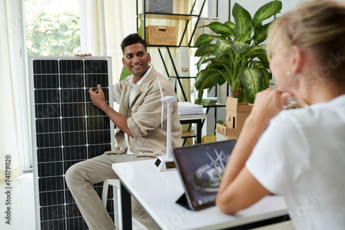 Seller telling customer advantages of solar panel