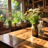 A beautiful bouquet of flowers in a jar sits on a wooden table in front of a window.