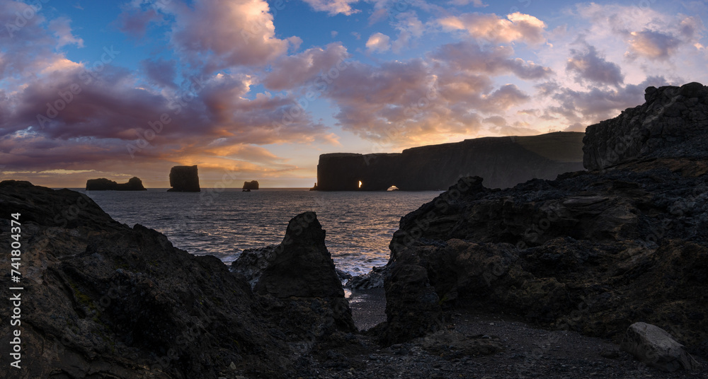 Picturesque autumn evening view Dyrholaey Cape, beach and  rock formations. Vik, South Iceland.