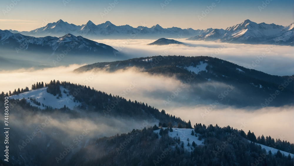 Snow-capped peaks beneath morning mist creating a serene and refreshing nature scene in the mountains.