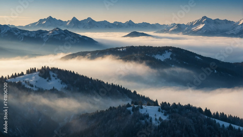 Snow-capped peaks beneath morning mist creating a serene and refreshing nature scene in the mountains.