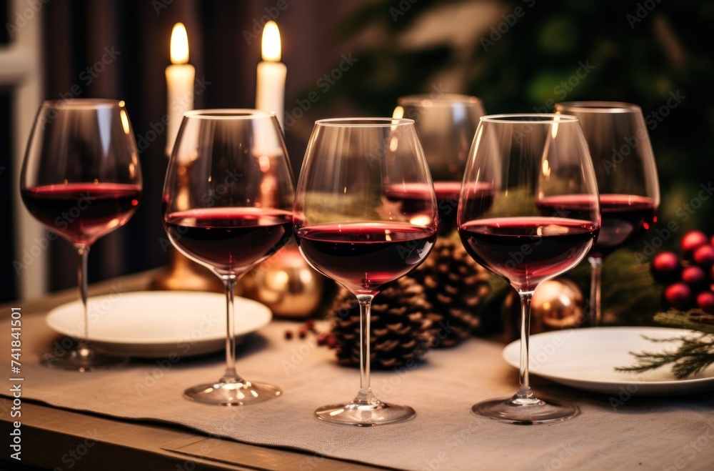 four wine glasses set up in a dining table for a holiday dinner