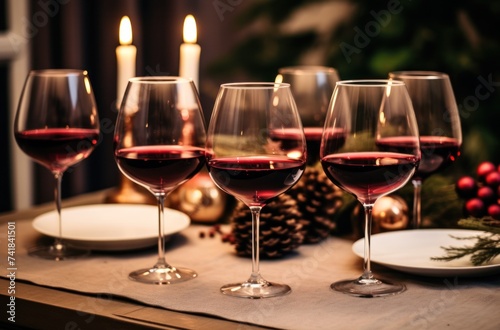 four wine glasses set up in a dining table for a holiday dinner