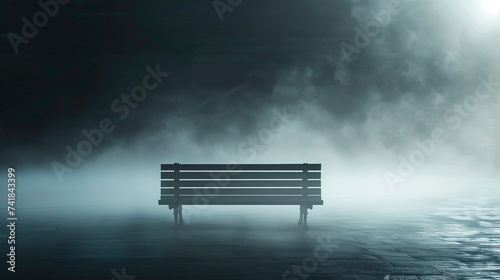 Solitary isolated wooden bench in evening mist. Concept of loneliness, isolation, the unknown in a moody, abstract style