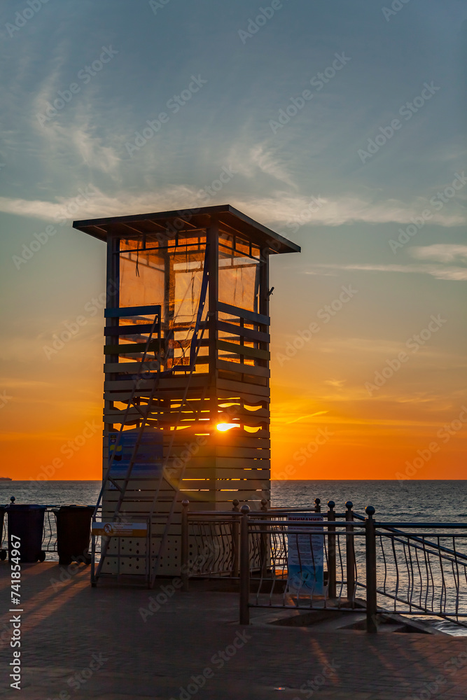 Zelenogradsk, Russia, June 15, 2023. Lifeguard tower on the sea embankment at sunset time