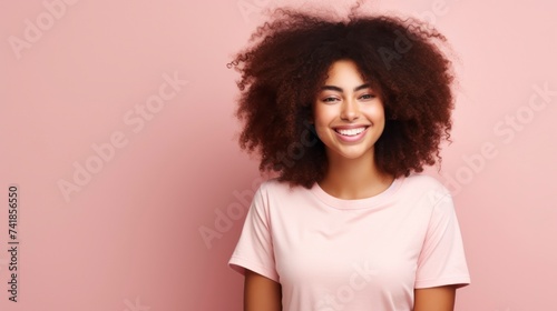 Young woman with afro hairstyle smiling at camera
