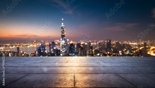 Concrete floor with cityscape and skyline background 
