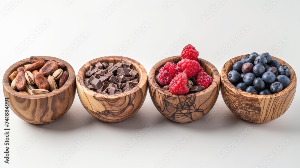 wooden bowls brimming with nuts, berries, and chocolate chunks on a clean background, inviting viewers to indulge in a wholesome and satisfying snack. wooden bowls brimming with nuts, berries, and chocolate chunks on a clean background, inviting viewers to indulge in a wholesome and satisfying snack.