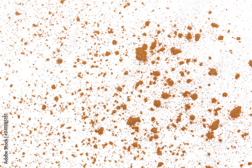 Cinnamon powder scattered isolated on white, texture, macro