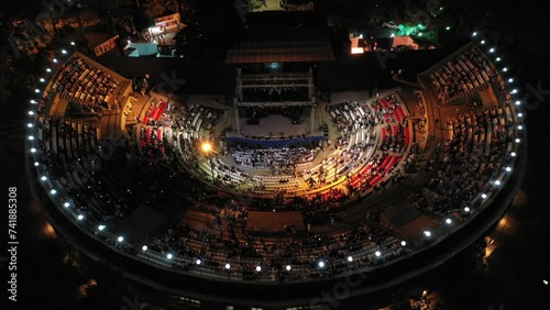 Aerial video of people watching a concert at an open-air theater