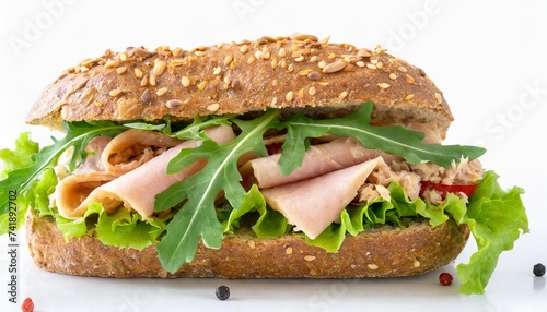 tuna salad sandwich with lettuce and arugula on whole grain bread isolated on white background