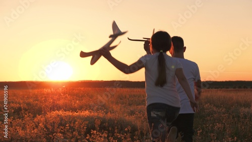 child airplane, children dream airplane pilot, child kid boy girl running with toy airplane across field, working team pilots, silhouette happy children running with toy airplanes hands, happy boy