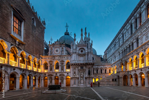 Venice, Italy - February 6, 2024: Courtyard of the Doge's Palace (Palazzo Ducale) in Venice. San Marco basilica in background photo