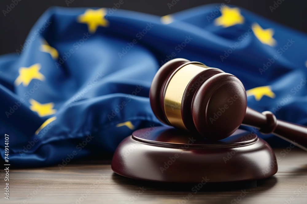 wooden judge's gavel and the flag of the European Union