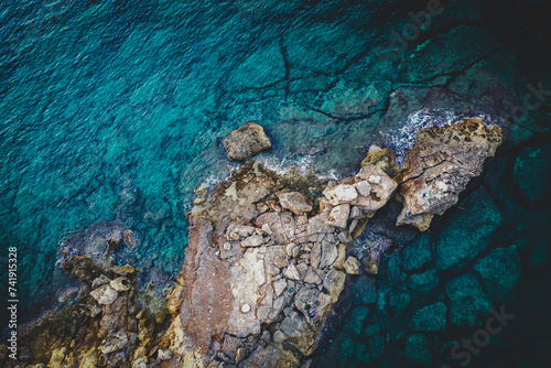 Mediterraneo y sus rocas para pescar. Transparent sea water 