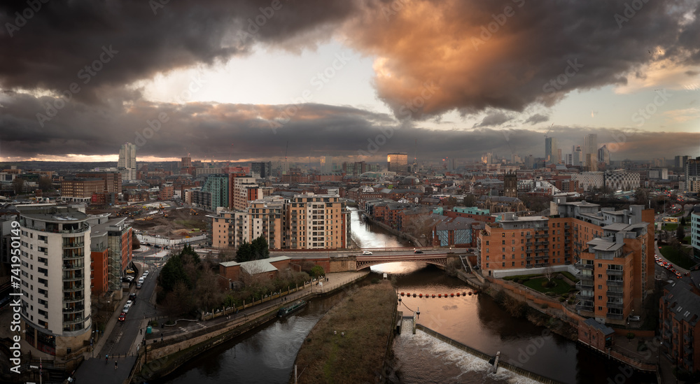 Aerial panorama of Leeds Dock and River Aire in a cityscape skyline at sunrise