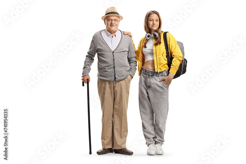 Teenage girl posing next to her grandfather