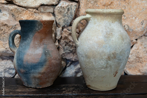 Old terracotta clay kitchenware jars and pots, ancient cookware © barmalini