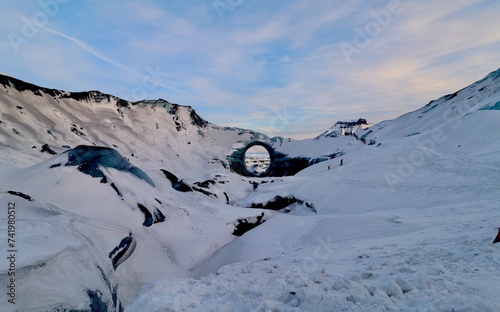 Dramatic Ice Cave Tunnel in the Glacier on Top of Katla volcano photo