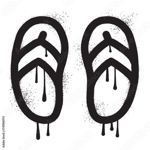 Graffiti a pair of sandals with black spray paint art