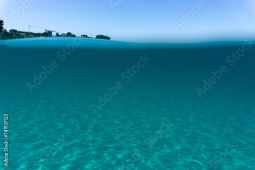 Fototapeta Naklejka Na Ścianę i Meble -  Beneath surface sand sun blue sky. High quality photo
