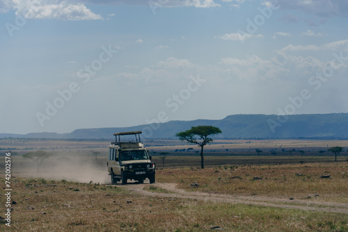 safari car running on the road in the Ngorongoro Conservation Area photo