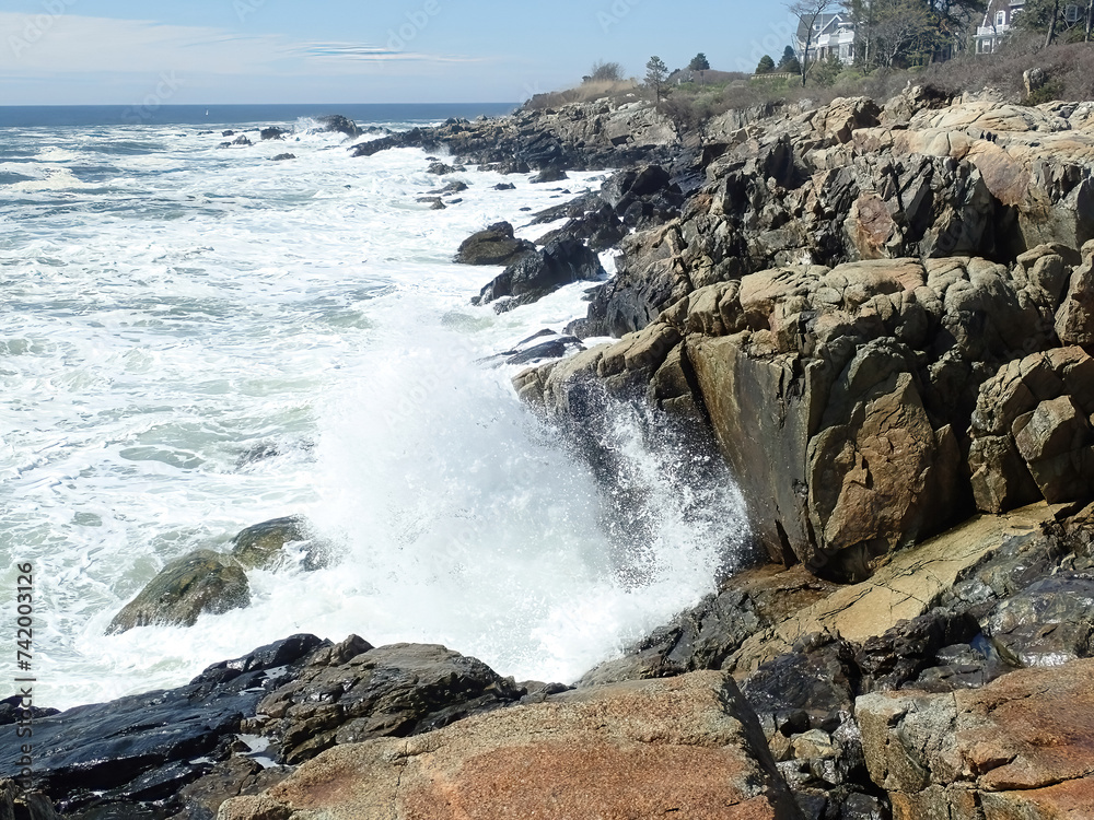 Ocean waves meeting a rocky shore