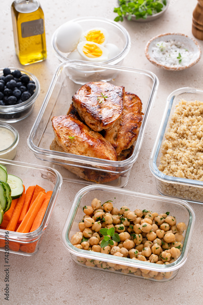 Meal prep containers with healthy food prepped, cooked chicken, quinoa, chickpeas and eggs Meal prep containers with healthy food prepped, cooked chicken, quinoa, chickpeas and eggs