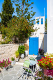 Entrance door to typical Greek style church in Kimolos village, Kimolos island, Cyclades, Greece