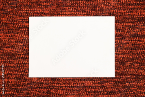 White blank sheet on a knitted background