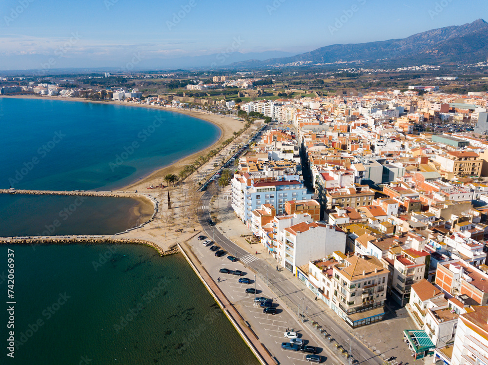 Panoramic aerial view of waterfront promenade in city Roses, Catalonia