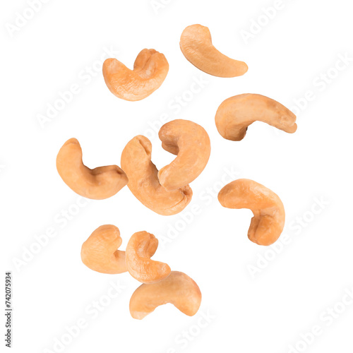 Falling roasted cashew nuts isolated on white background. 
