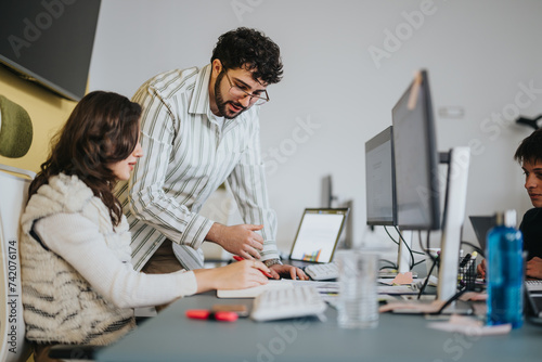 Employees collaborating in a creative office. Coworkers discussing reports and brainstorming ideas for project development. International team strategizing for market analysis and revenue growth.