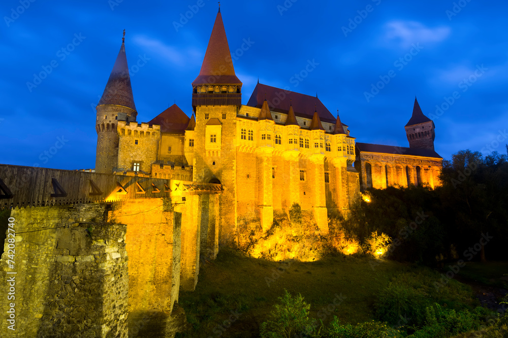 Medieval Corvin Castle in south of Transylvania in night lights, Hunedoara, Romania