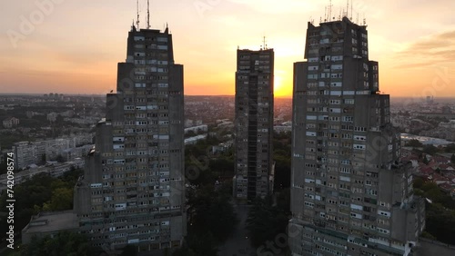East gate of Belgrade, Silhouette of Brutalist Condominium complex at sunset. Aerial of unique Architecture in Serbia photo