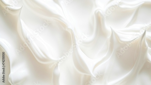 Texture of skin care cream. White lotion and moisturizer cosmetic product background .Soft waves of cream contain white silky fabric creating a soothing, warm texture. photo