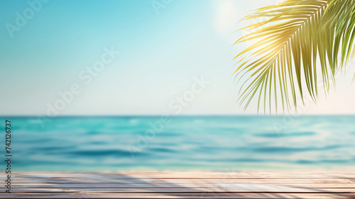Blue sea, yellow beach and a palm leaf hanging from above, a sight heralding the arrival of summer