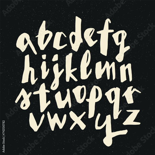 Vector handwritten calligraphic ink alphabet, white on black background. Hand drawn alphabet written with brush pen. Minuscula – small letters. (ID: 742130782)