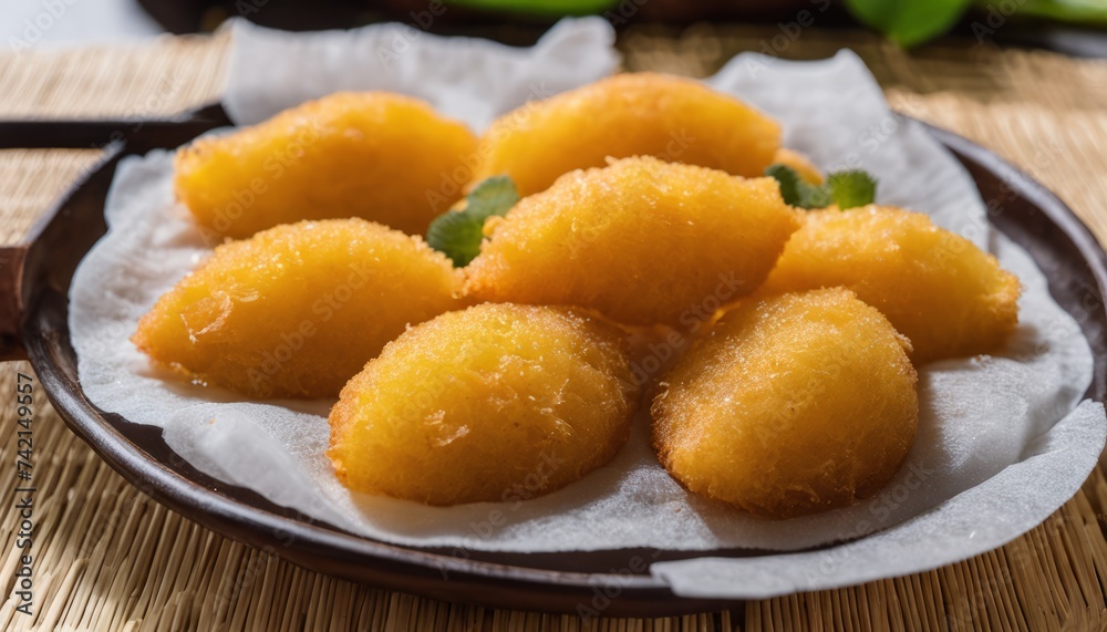 Golden-brown fried food on a plate, ready to be savored Golden-brown fried food on a plate, ready to be savored