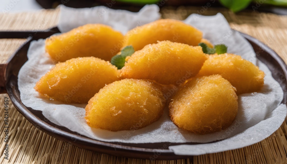  Golden-brown fried food on a plate, ready to be savored