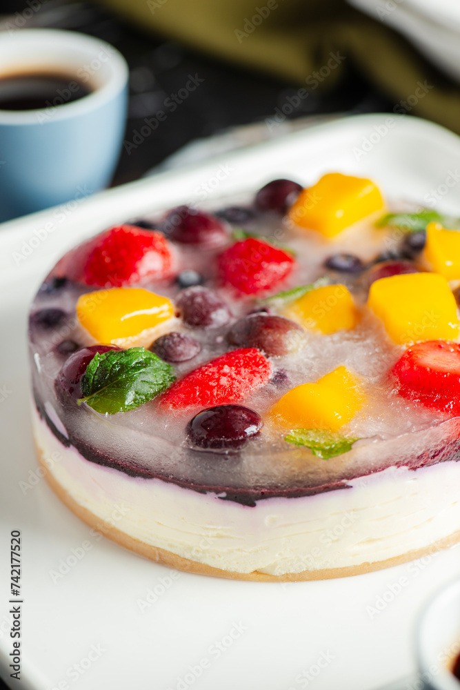 Delicious and light no-bake cheesecake with summer fruits including strawberry, mango, and grapes. Delicious and light no-bake cheesecake with summer fruits including strawberry, mango, and grapes.