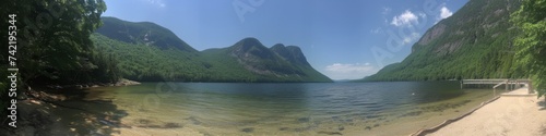 Tranquil Lake with Wooden Path and Mountain Background