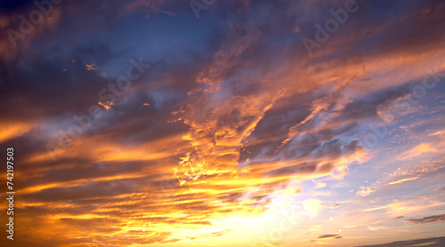 Clouds background. Dramatic Clouds Sunset Background. Sky with clouds in Sunrise. Sunrise with clouds in various shapes background. Calm Cloud. © Volodymyr