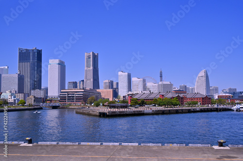 cityscape of skyline Yokohama and Yokohama Port city with blue sky background, Minatomirai area in Yokohama city, Kanagawa, Japan © lukyeee_nuttawut