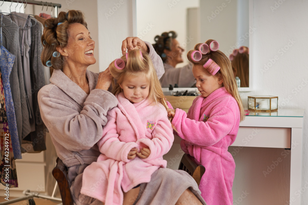 Hairstyle, home and grandmother with girls, fun and holiday with vacation and grooming. Family, dress up and granny with grandchildren or playing with joy and relaxing with equipment or weekend break