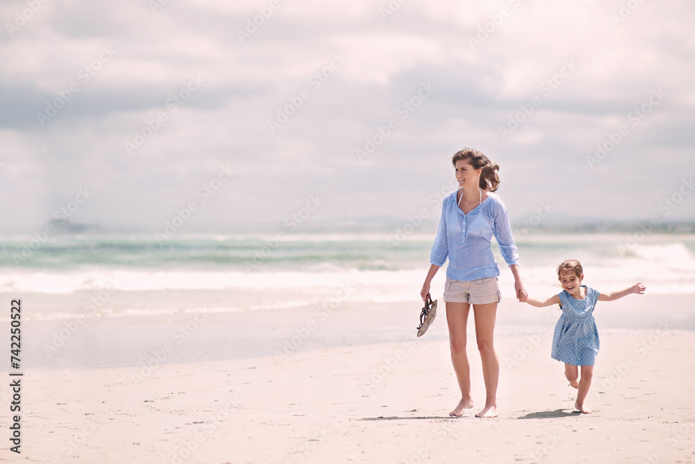 Mother, child and hand holding on beach travel or explore environment or windy summer or holiday, weekend or bonding. Female person, daughter and relax at Australia seaside or peace, vacation or trip